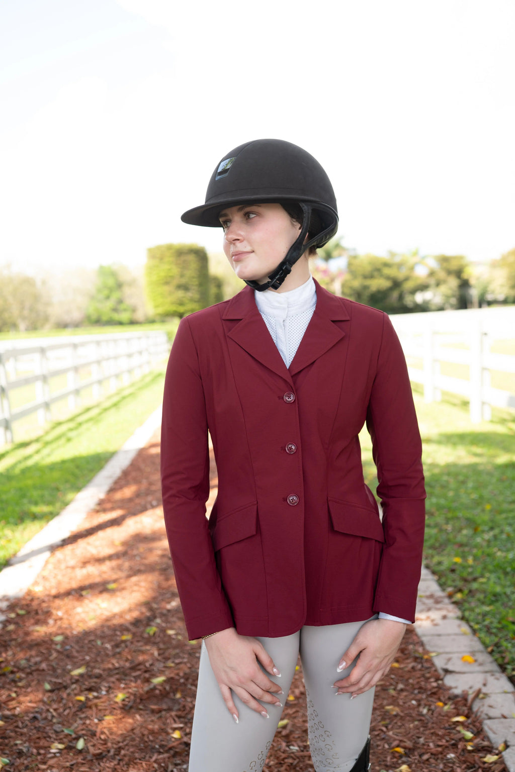 Burgundy ladies show jacket with three buttons and front pockets