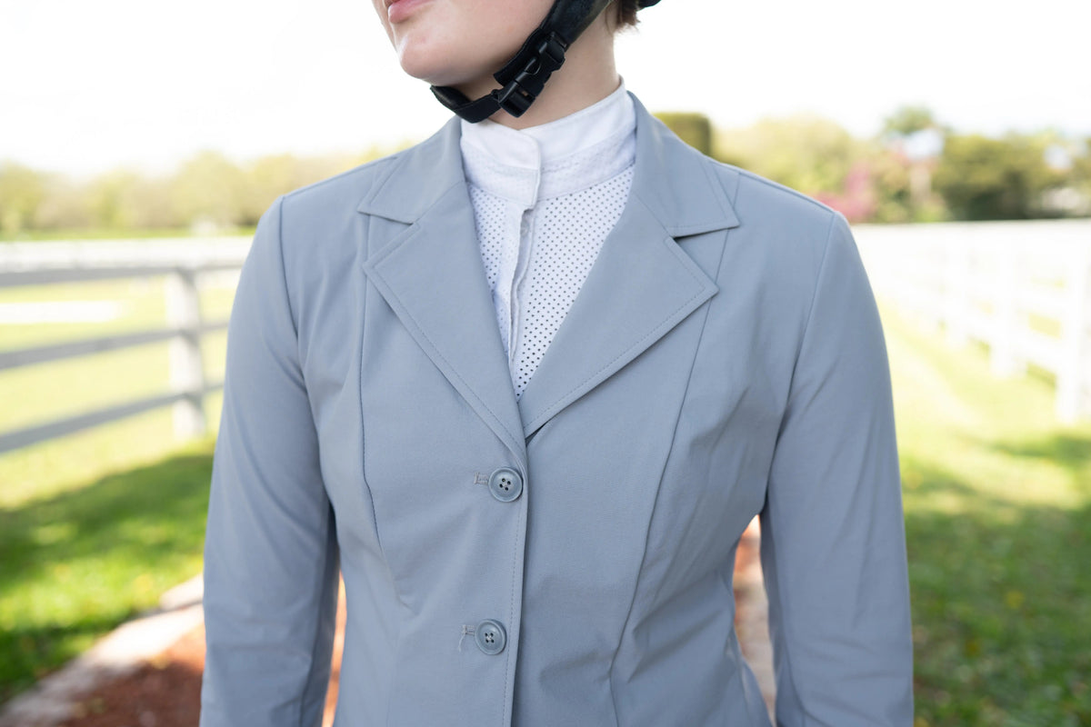 Cadet blue ladies show coat detail with notched lapels and three-button front