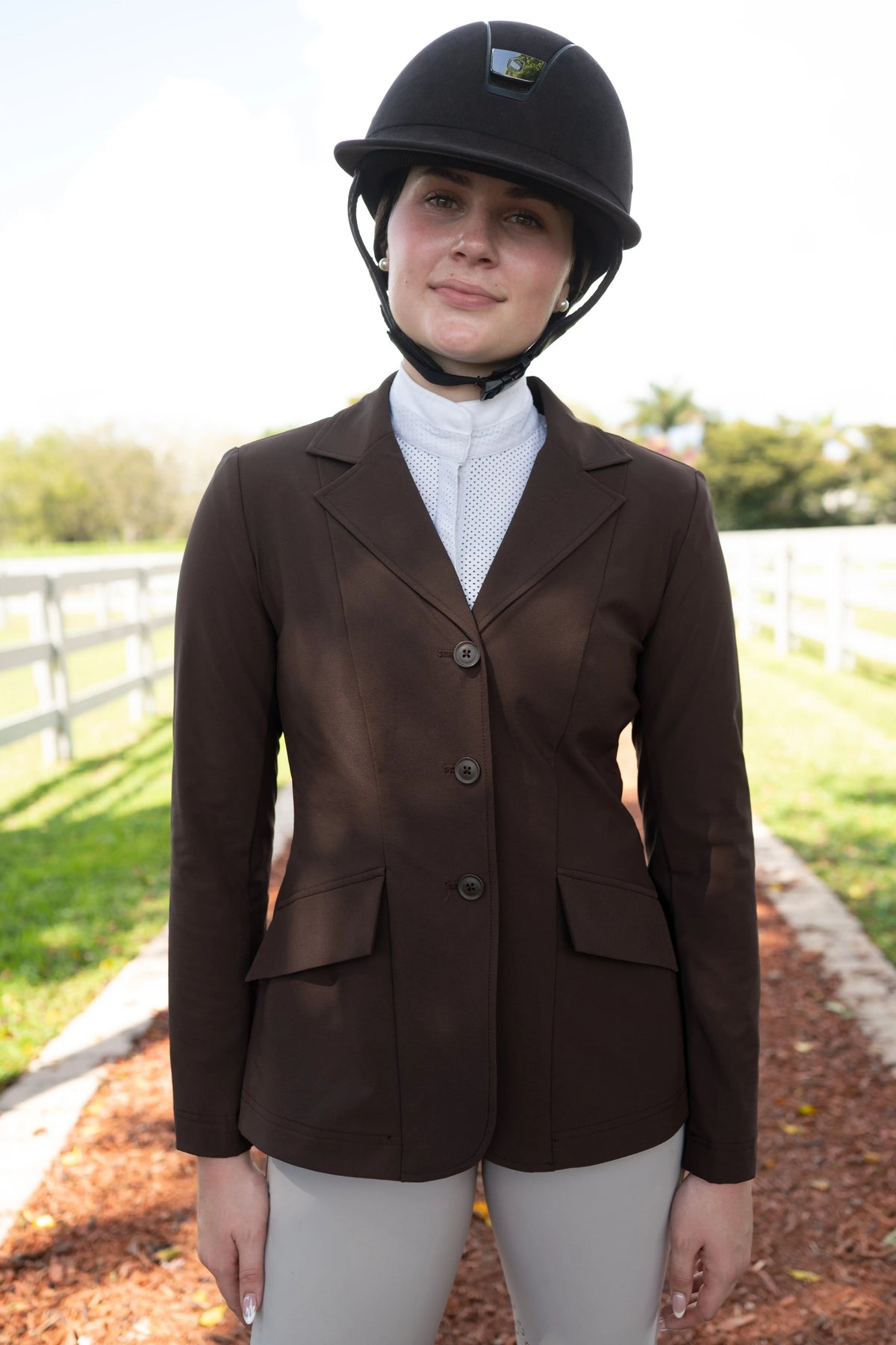 Women’s chocolate-brown equestrian show coat with notch lapels and three buttons
