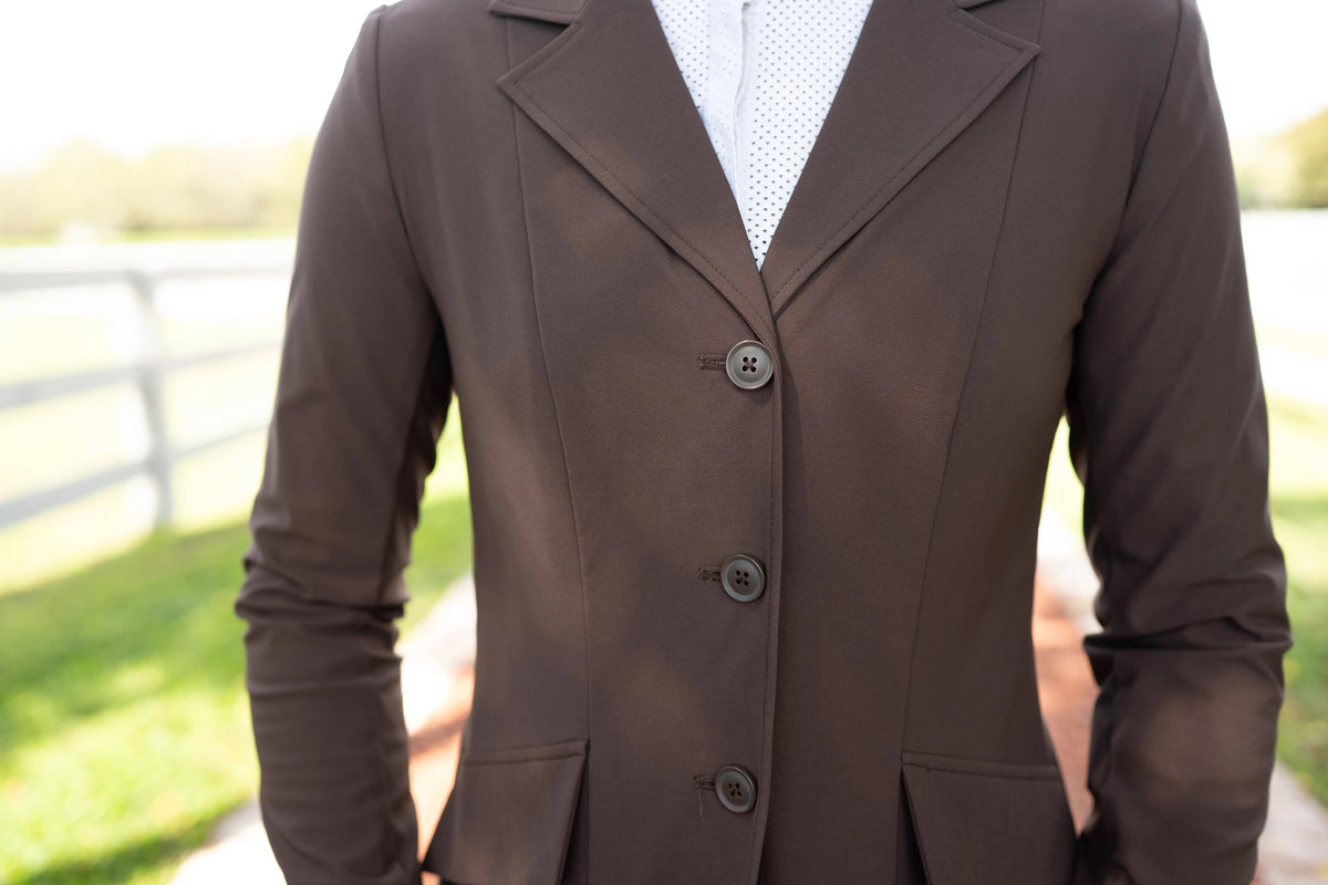Chocolate-brown show coat close-up with button placket and chest pocket flap