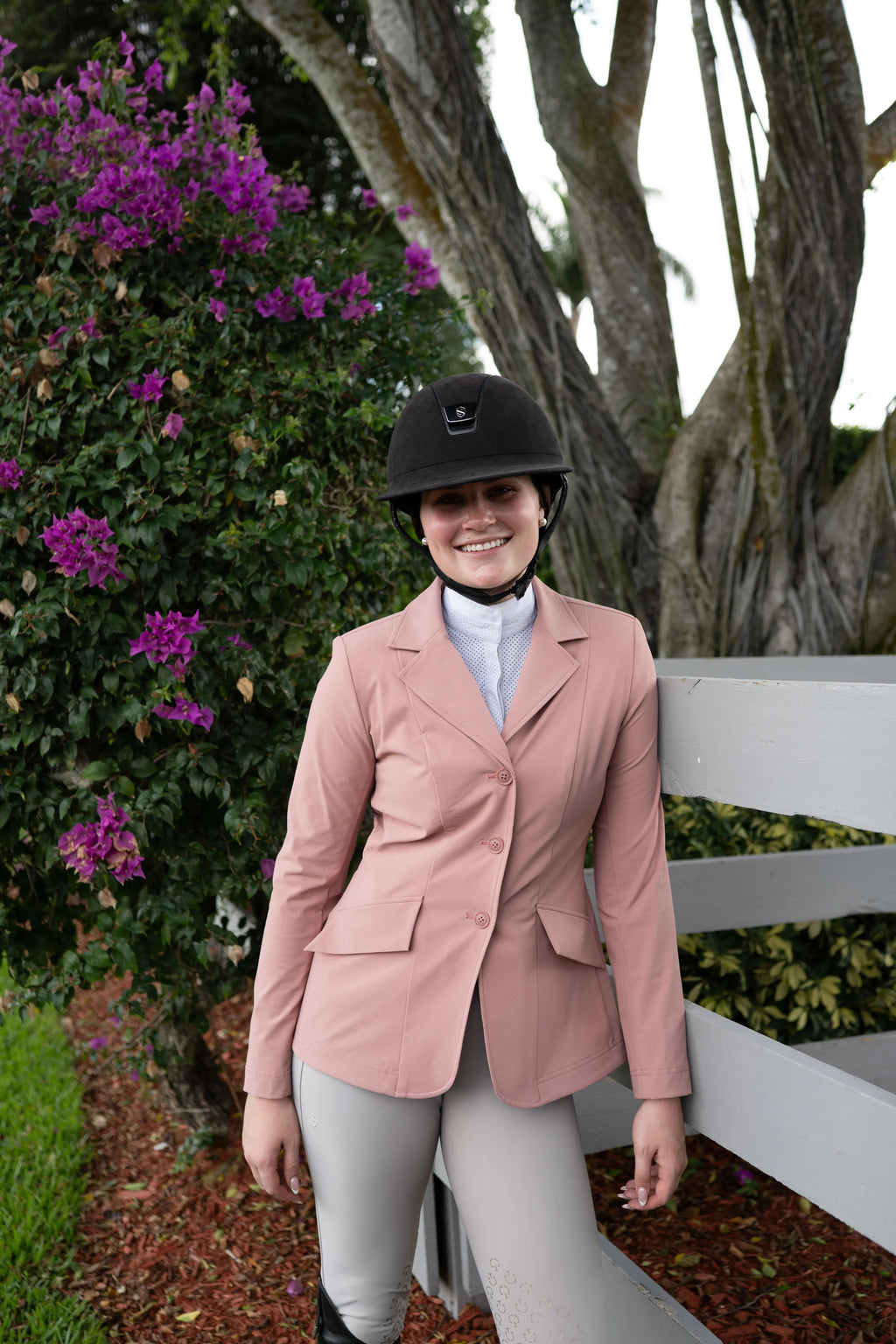 Rose pink ladies show coat with three-button front and tailored flap pockets