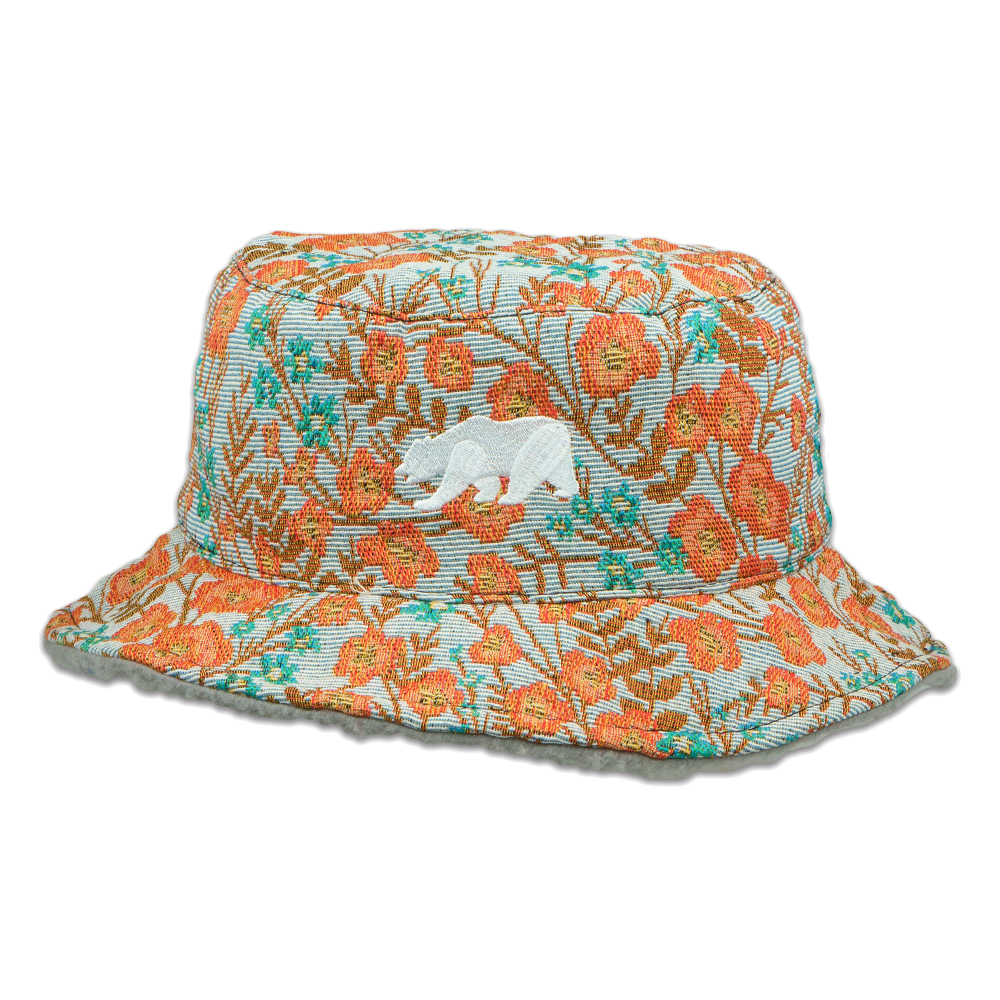 Reversible bucket hat with orange and teal floral print, wide brim