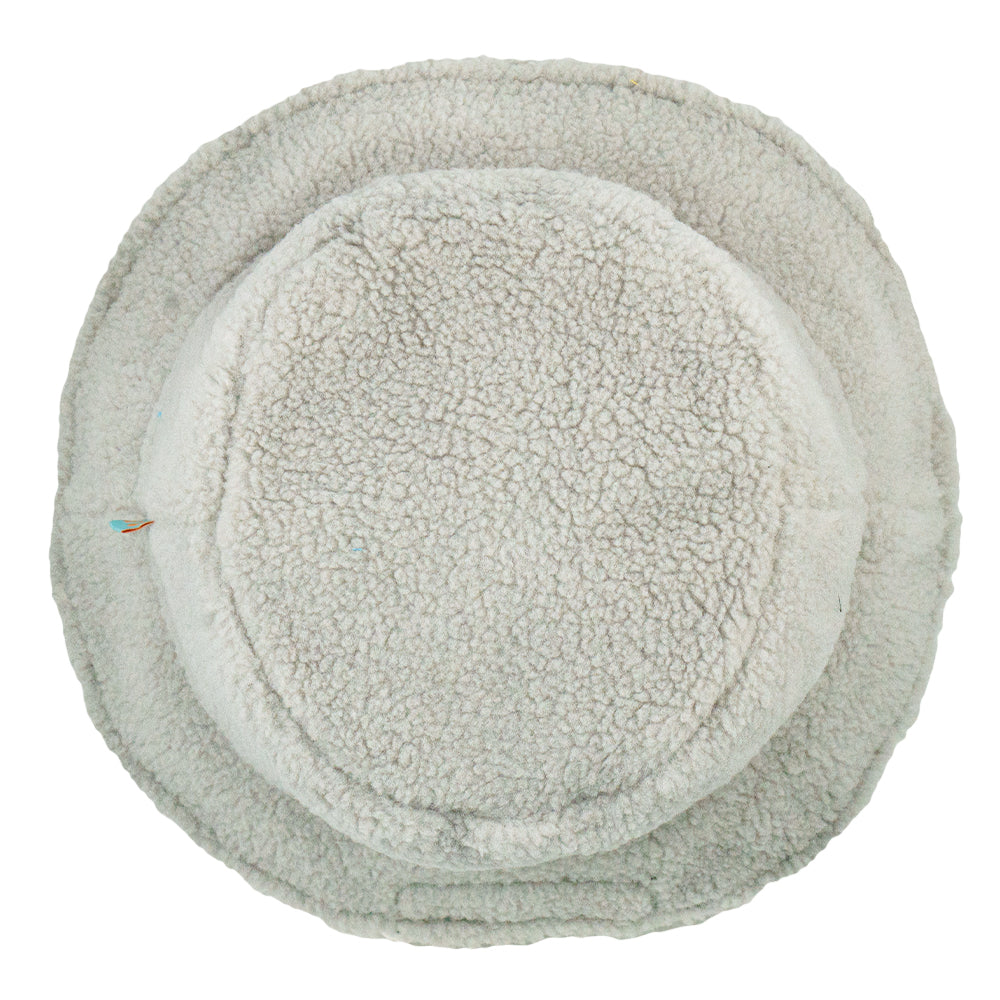Reversible bucket hat interior in light gray sherpa with circular center