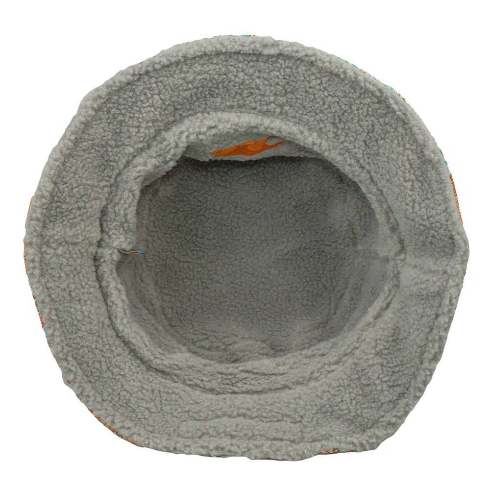 Reversible bucket hat interior in light gray sherpa with orange bear detail