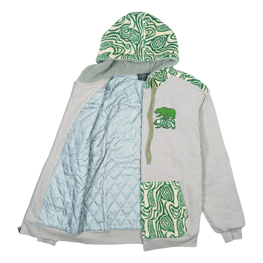 Light gray zip-up hoodie with open front revealing light blue quilted lining and green bear patch