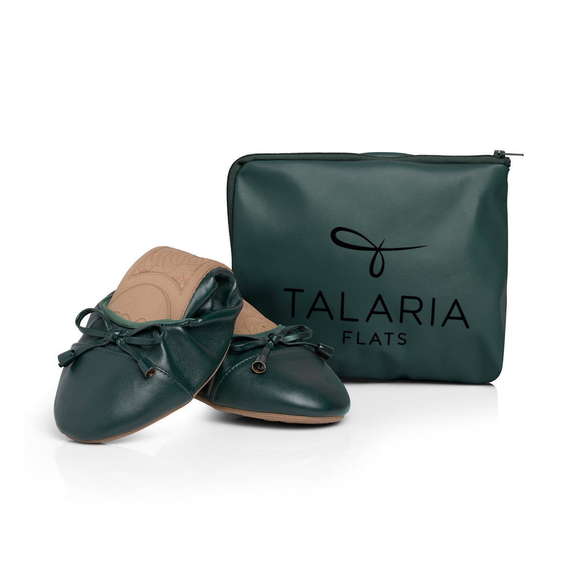 Dark green flats with tan insoles next to zip storage pouch
