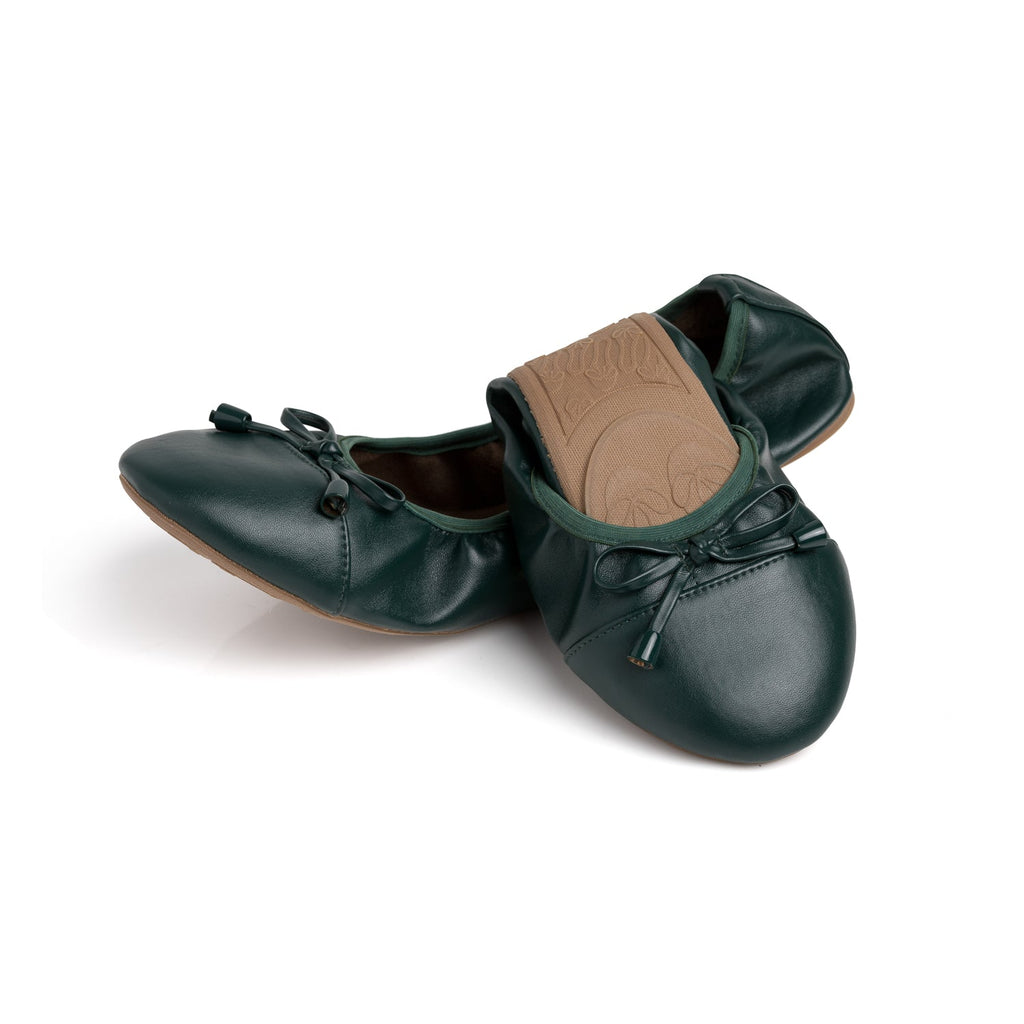 Dark green leather flats with bow-tie detail and tan insole