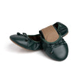 Dark green leather flats with bow-tie detail and tan insole