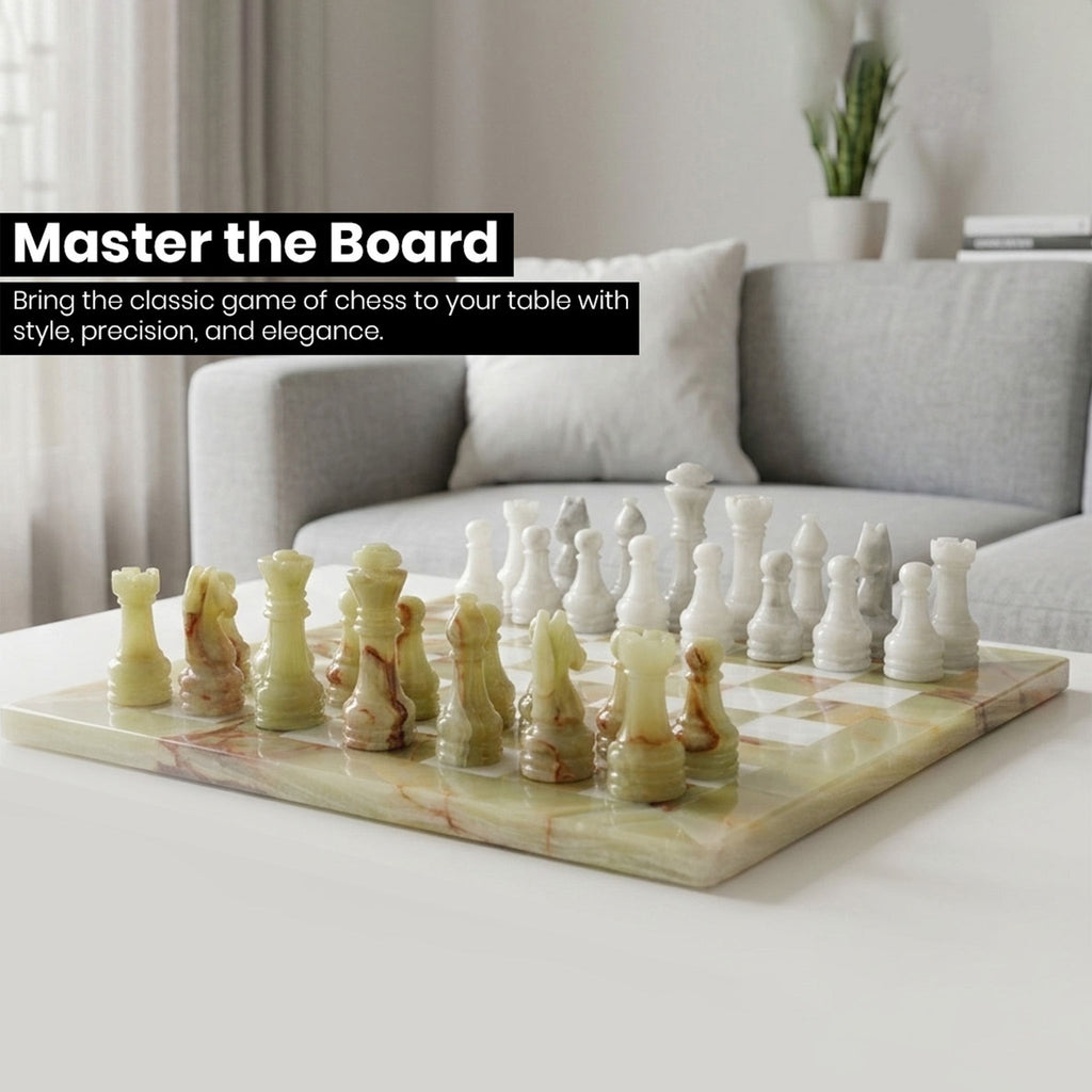 Green and white marble chess board with gold and white chess pieces and kings at front