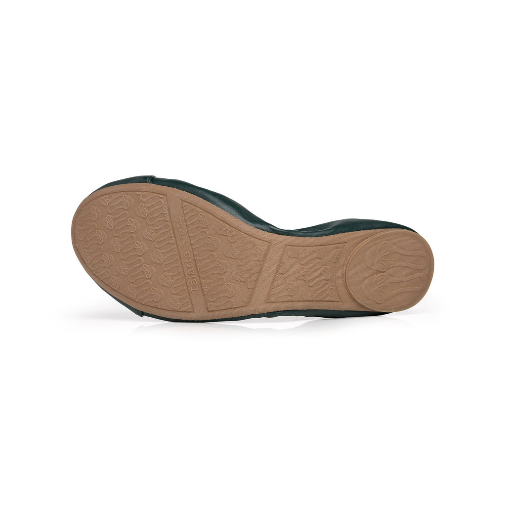 Dark green flat sole with textured tan rubber tread