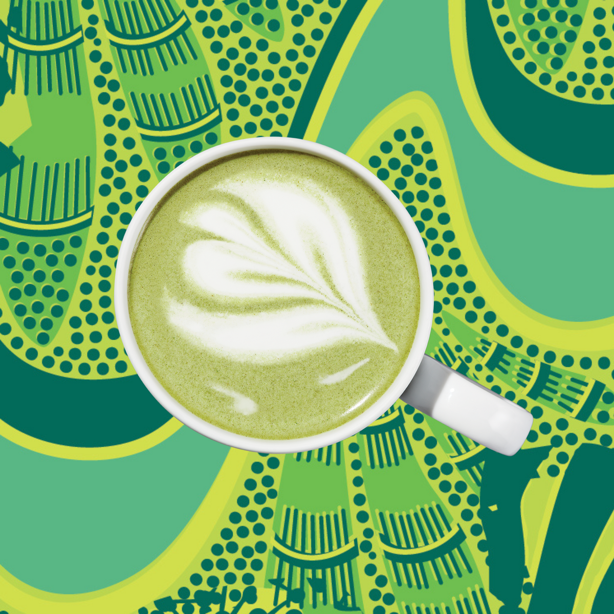 White latte cup with green matcha foam art, top view