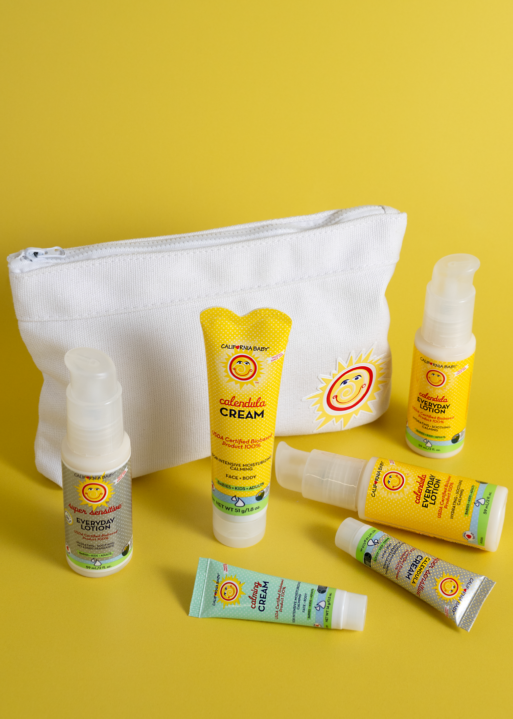 White zippered travel pouch with sun-face patch and top zipper