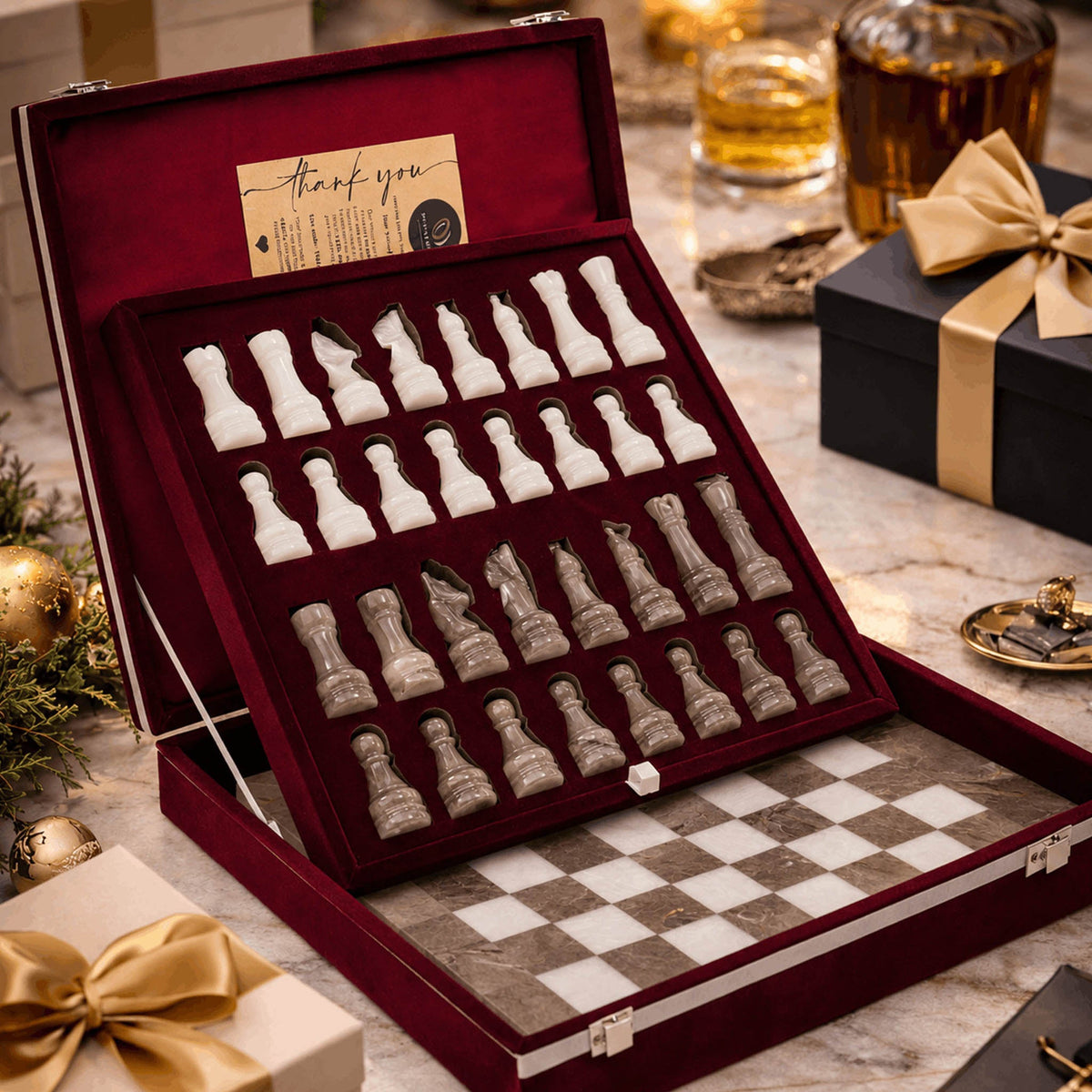 Marble chess set pieces in a velvet-lined presentation case with stone board
