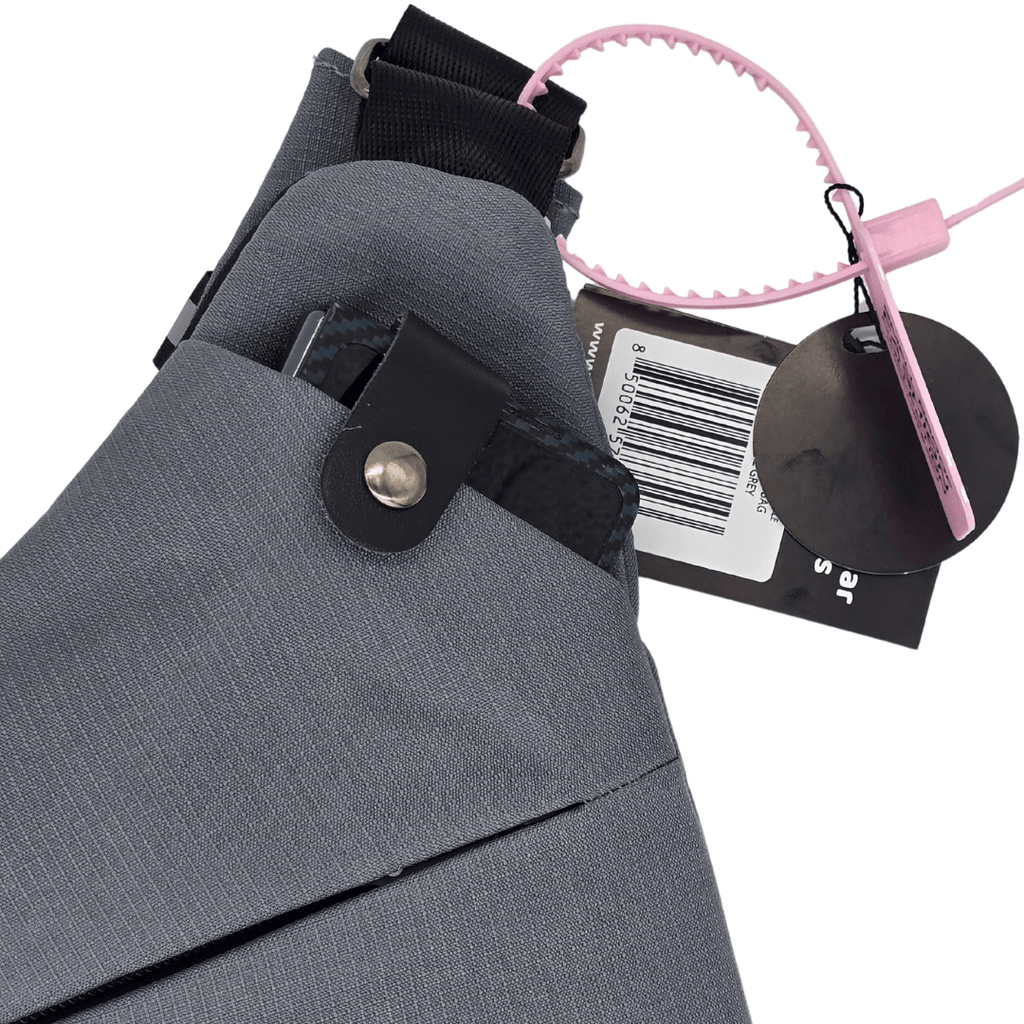Gray crossbody bag with clip hardware and barcode retail tag