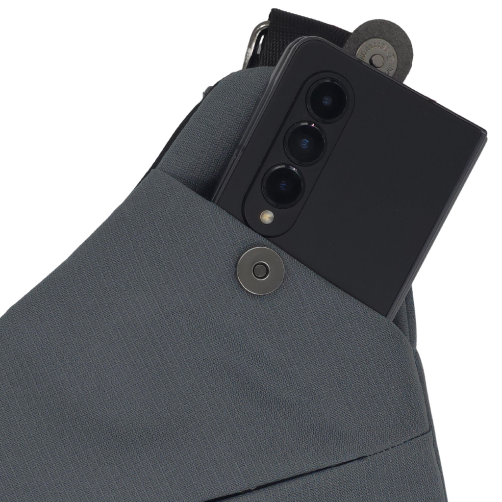 Smell-proof crossbody bag with hidden lock panel, dark gray fabric and adjustable strap