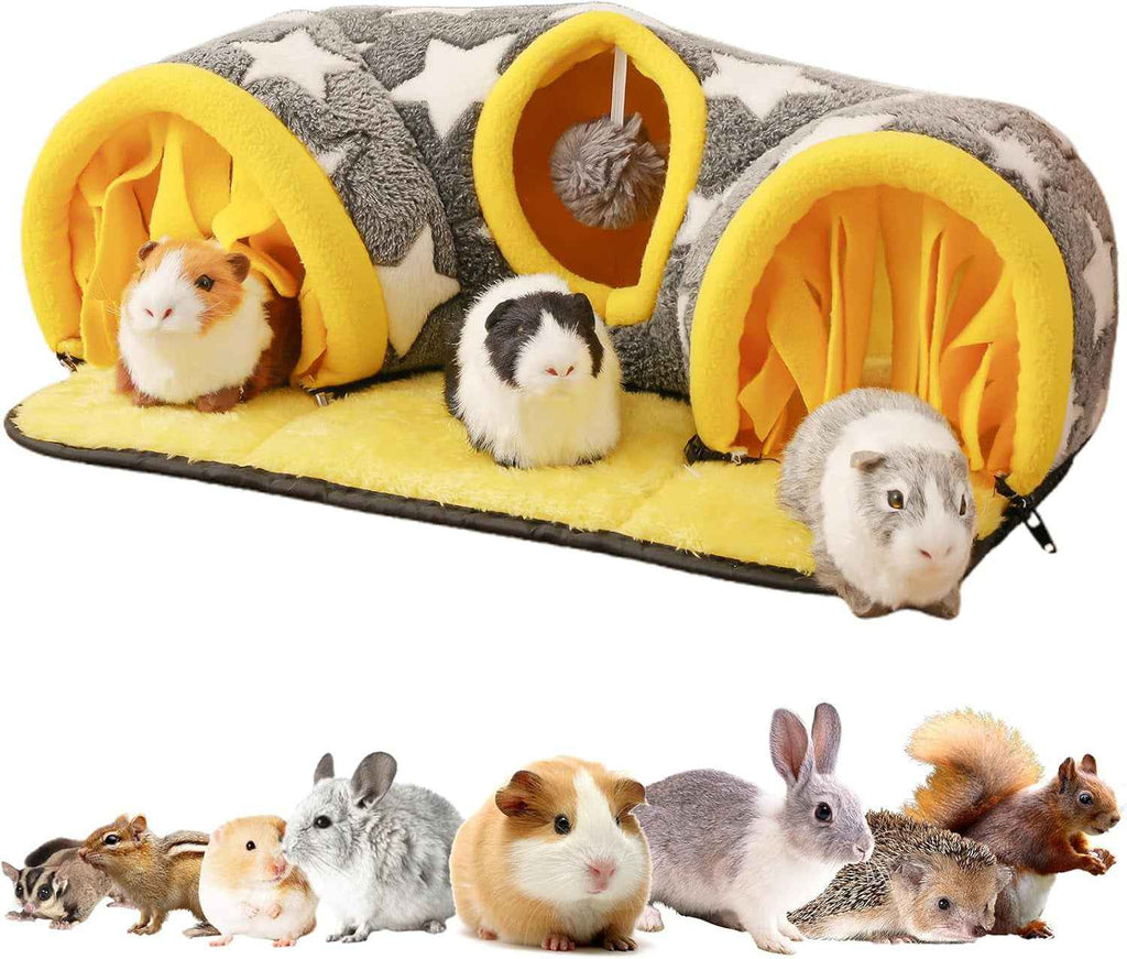 Star-print guinea pig tunnel bed with yellow entrances, plush mat, and hanging toy ball