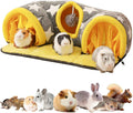 Star-print guinea pig tunnel bed with yellow entrances, plush mat, and hanging toy ball