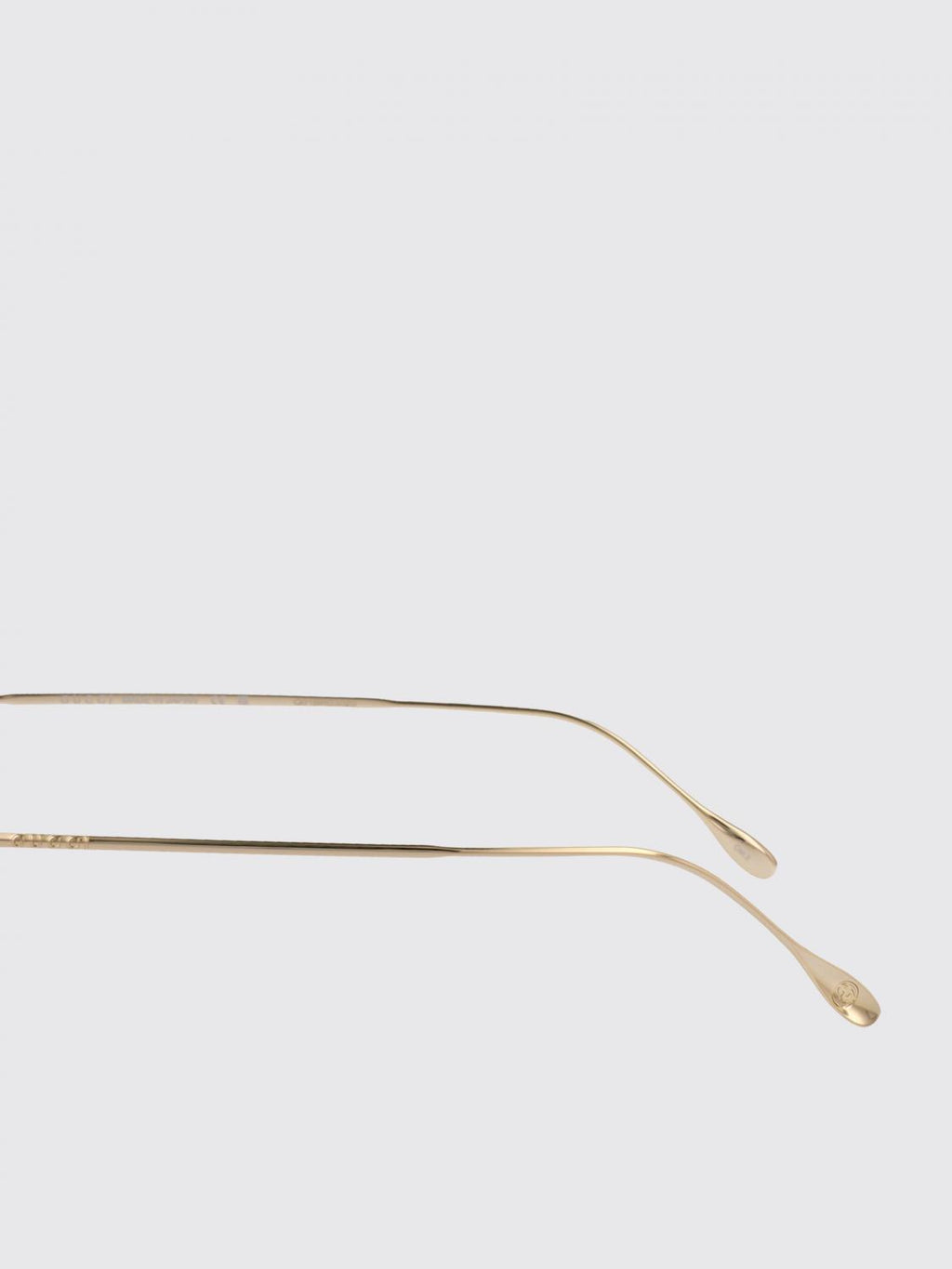 Gucci gold metal sunglasses with slim temples and brown tinted lenses