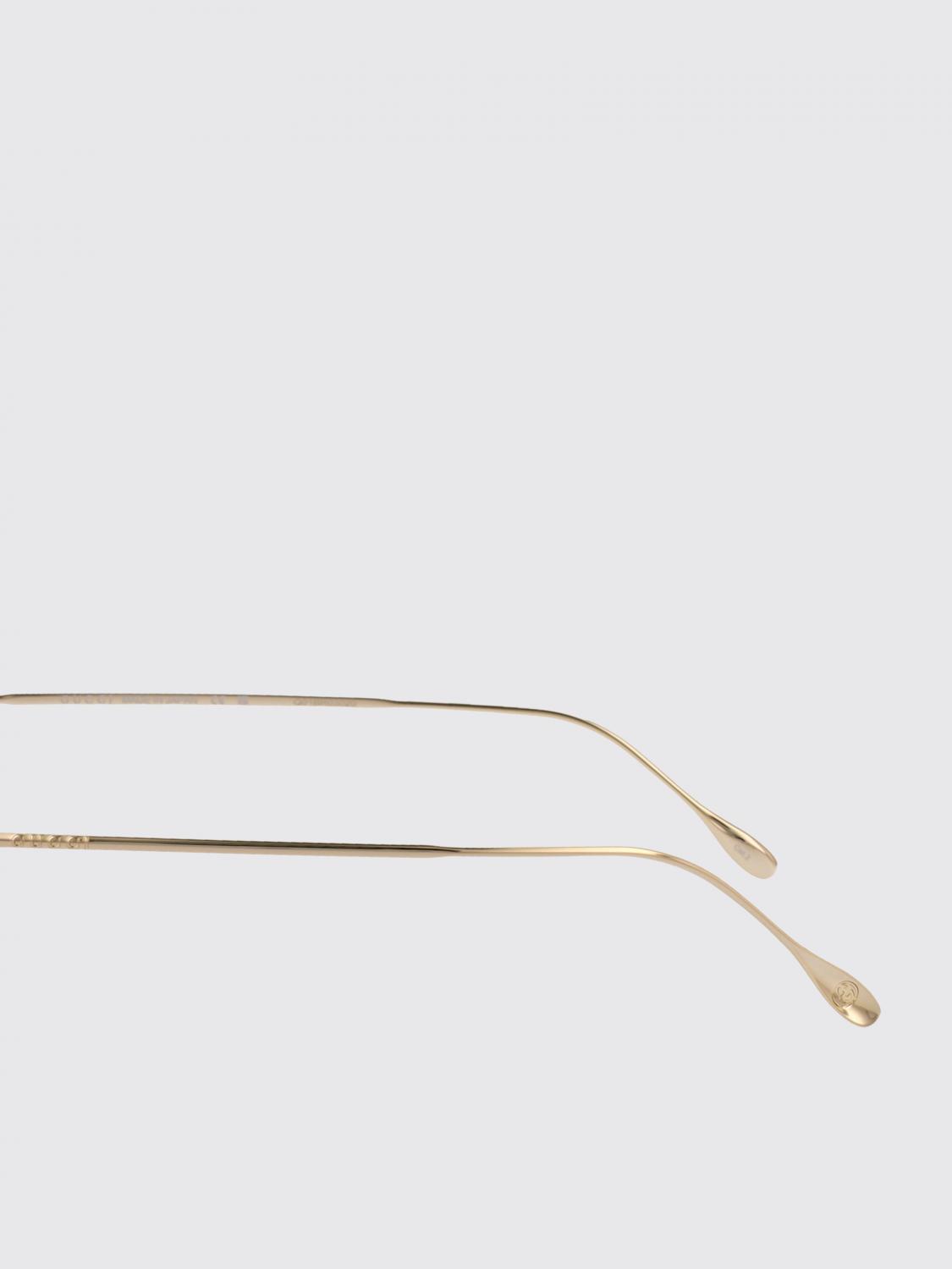 Gucci gold metal sunglasses with slim temples and brown tinted lenses