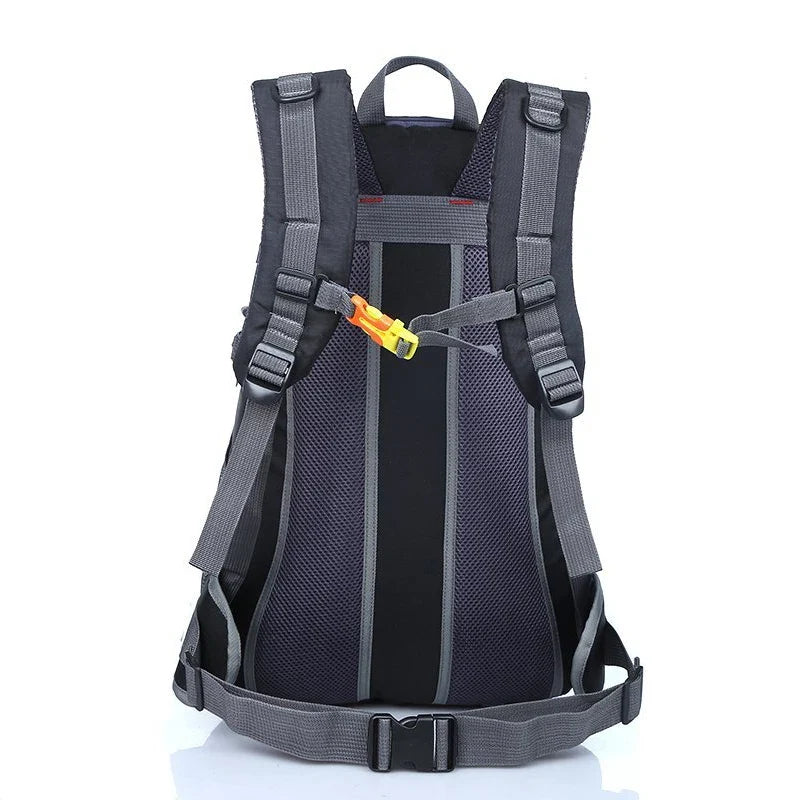 Water-resistant hiking backpack with front harness straps, chest strap, and padded back panel