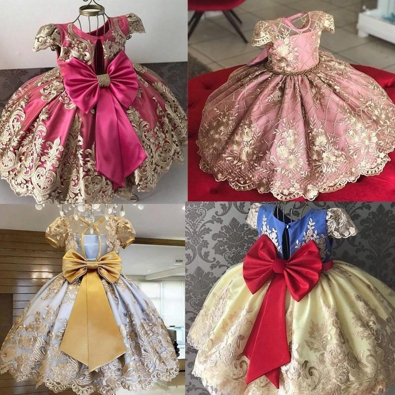 Baby girl princess tutu dress in fuchsia satin with large bow and gold embroidered skirt