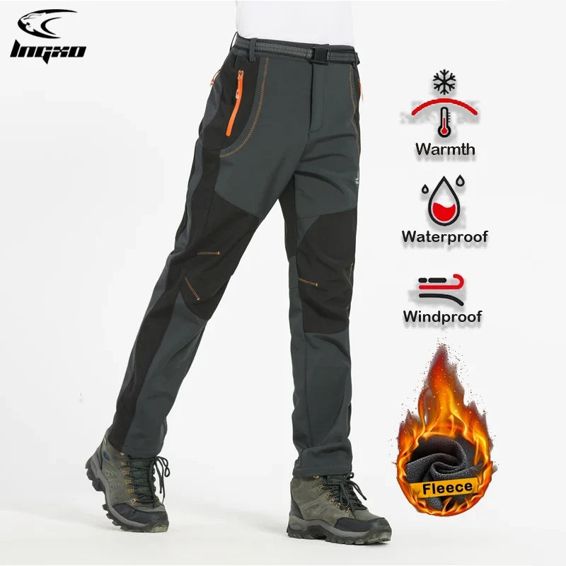 Men's green hiking pants side view with zip pockets and adjustable ankle cuffs