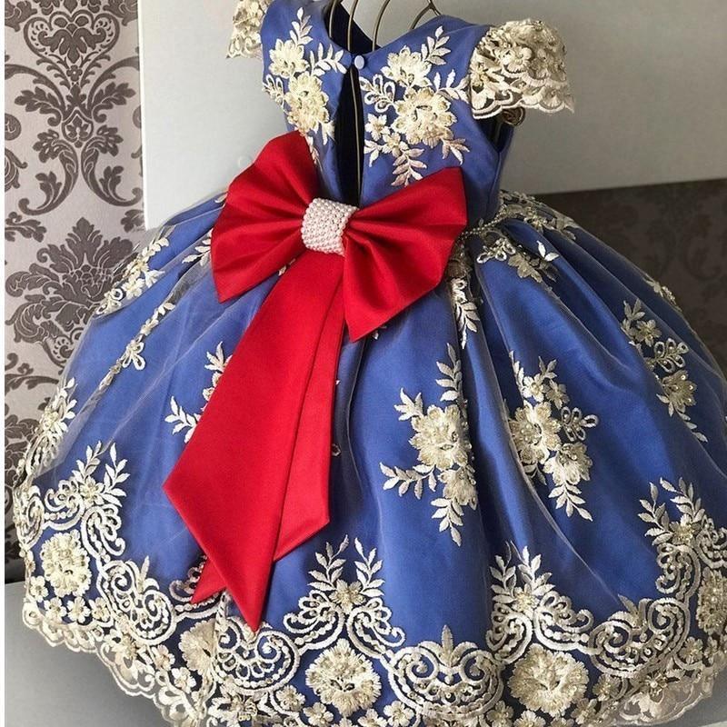 Baby girl princess tutu dress with navy satin bodice, white-gold embroidery, and red bow