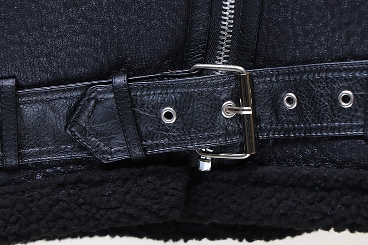 Black moto jacket belt with metal buckle and eyelet strap detail