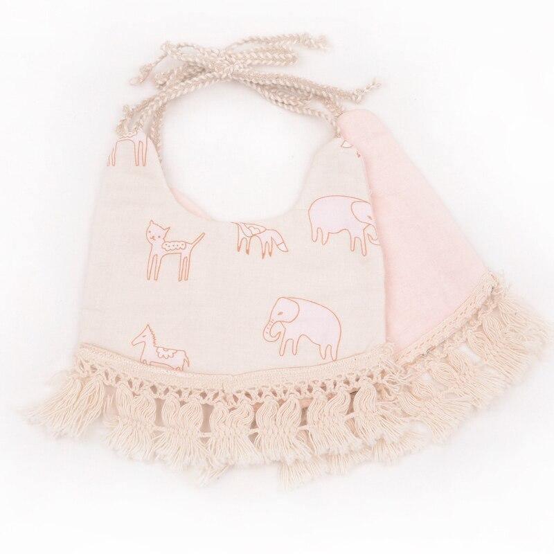 Light pink animal print double bib set with fringe trim and braided ties.