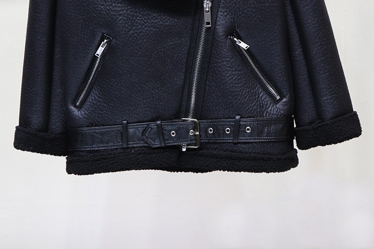 Black moto jacket front with center zipper, zip pockets, and snap-belt waist