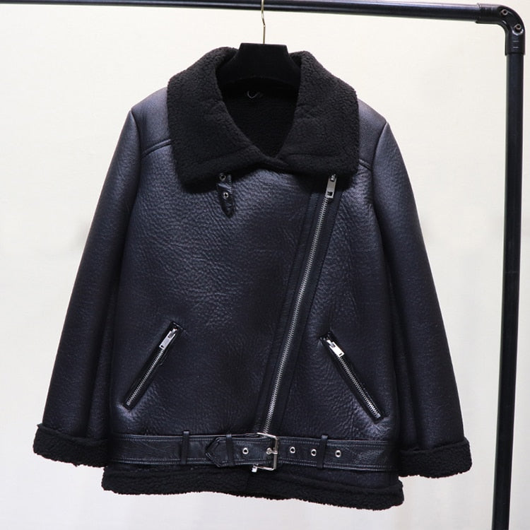 Black faux lamb leather moto jacket hanging with shearling lining and front zips
