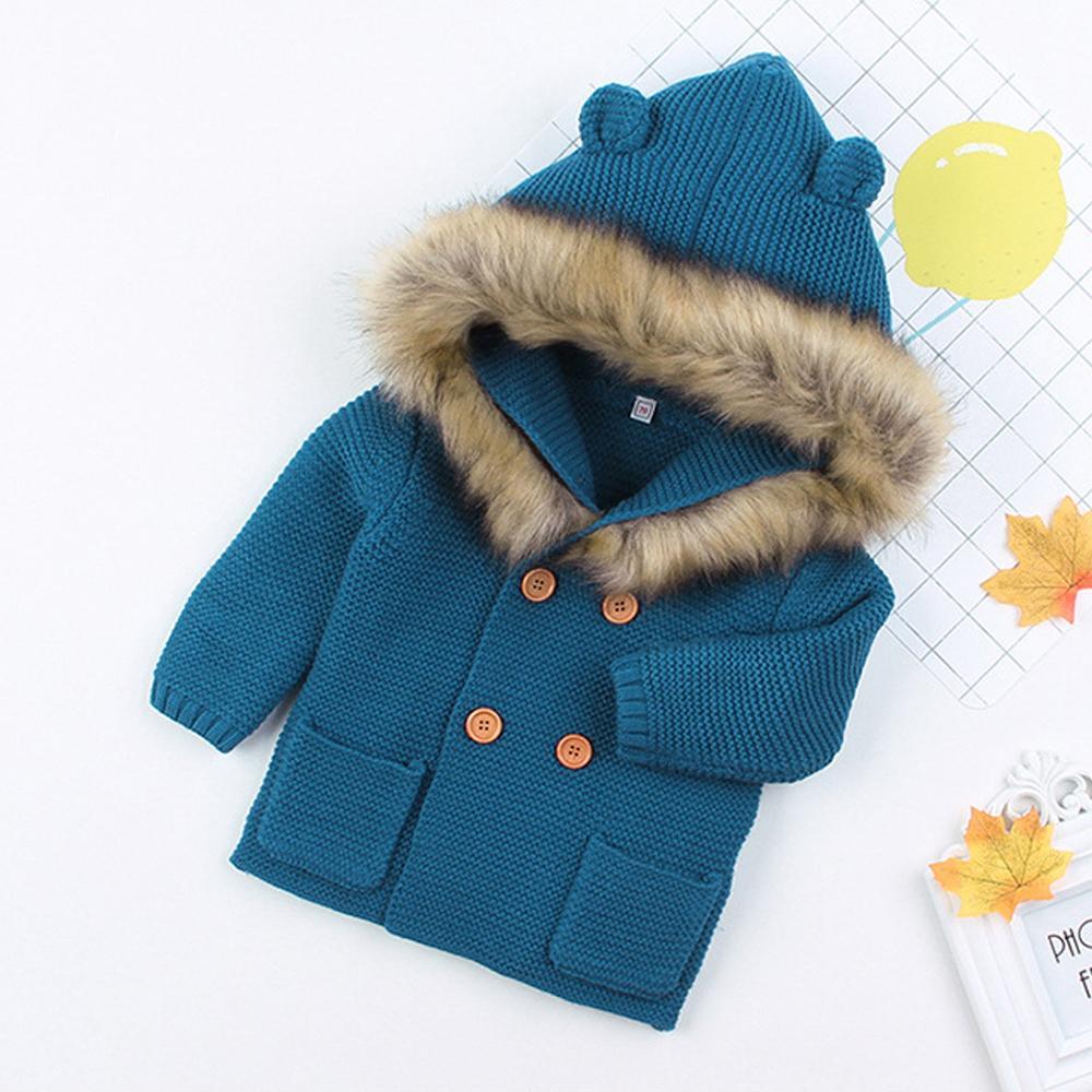 Newborn knit hooded jacket, teal-blue with tan faux-fur hood trim and button front