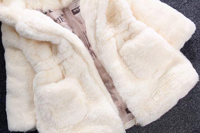 Cream white hooded plush jacket close-up, front zipper and padded hood lining