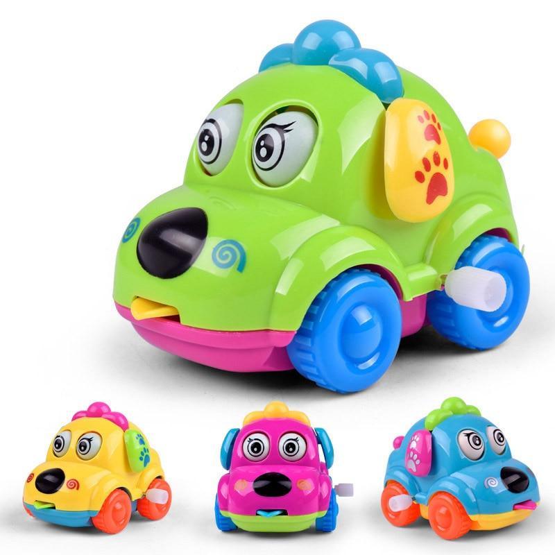Green cartoon dog wind-up toy car with blue wheels and paw-print side detail