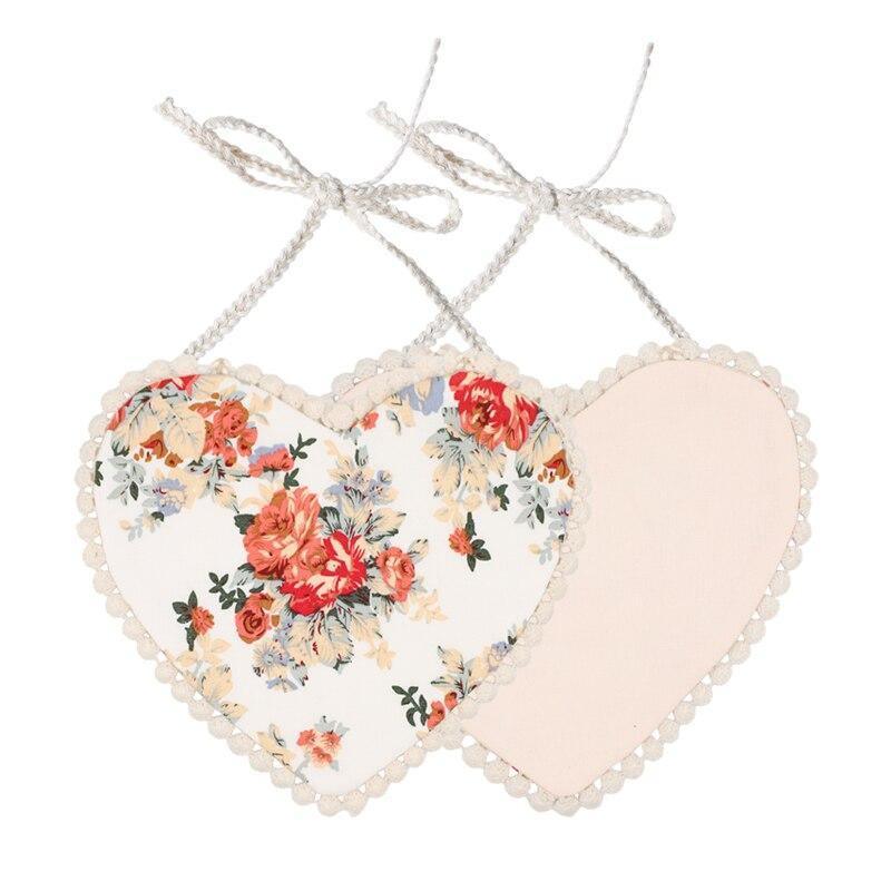 Infant heart bib set with blue floral print fronts and blush heart back