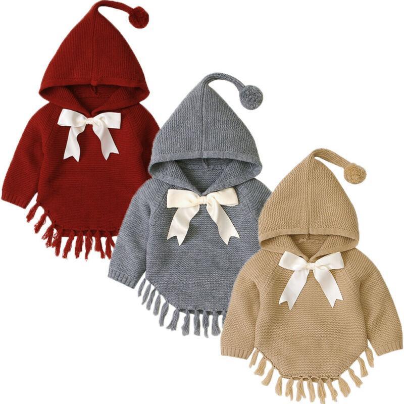 Set of knitted hooded toddler pullovers with white bows and tassel-trim hems in red, gray, khaki