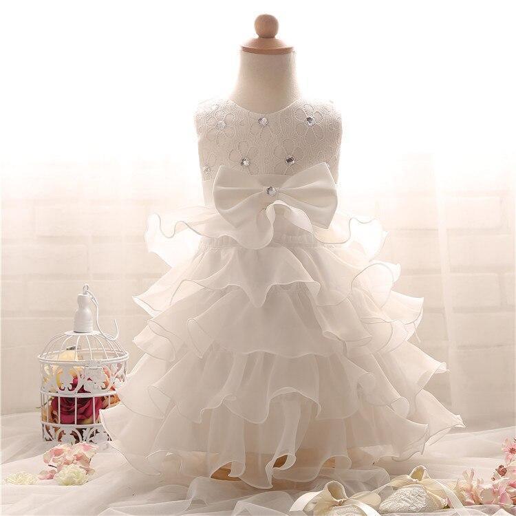 White ruffled tutu dress with lace bodice and large satin bow