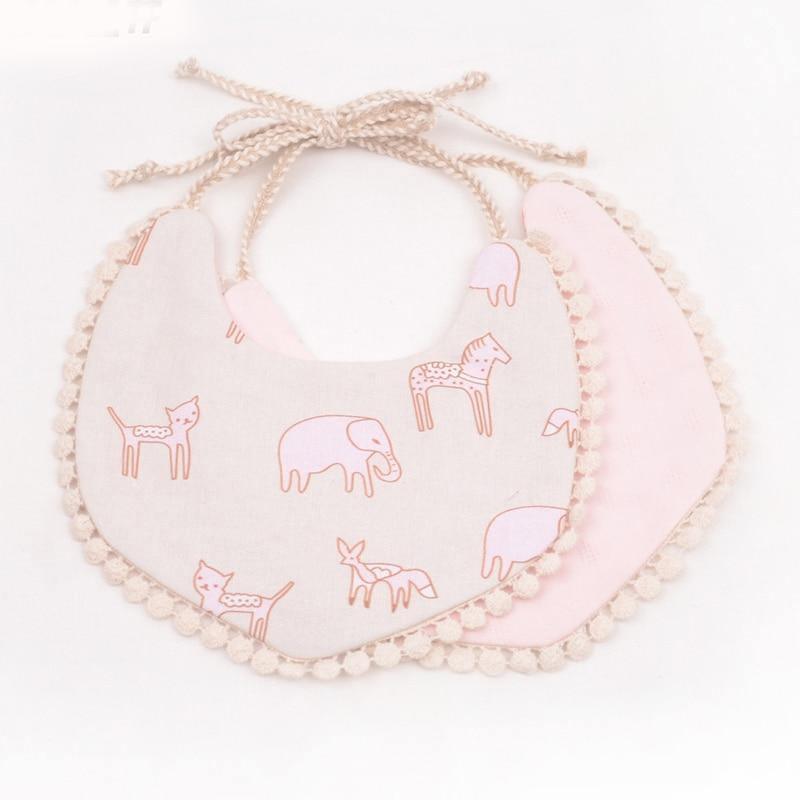 Light pink double-layer baby bib set with animal print front and pom trim tassel ties