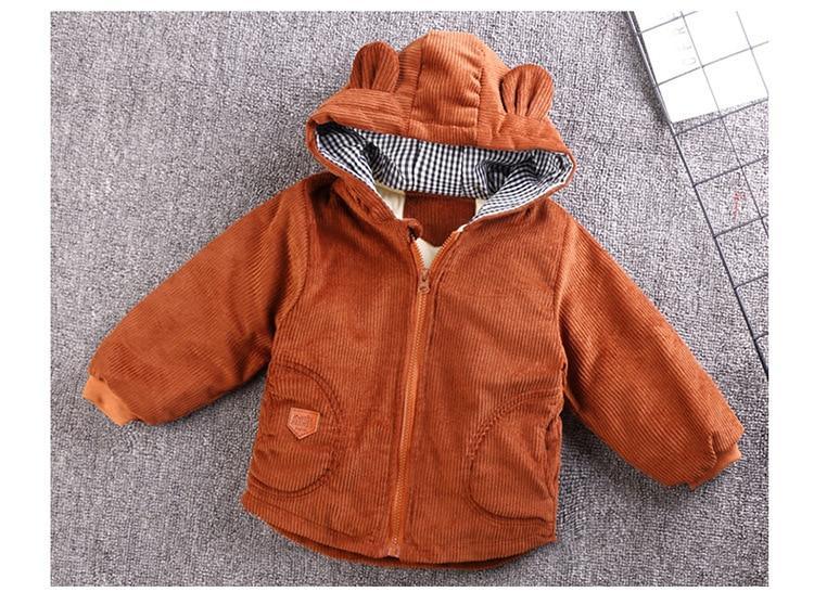 Orange hooded baby jacket, zip front and corduroy texture