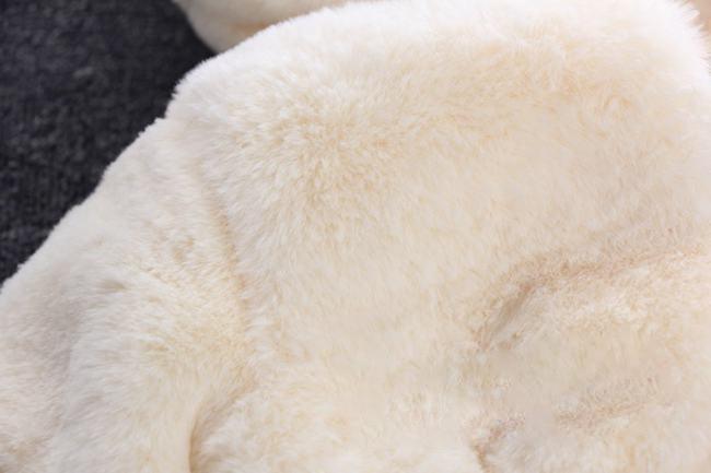 Cream hooded plush jacket with soft, fluffy outer texture