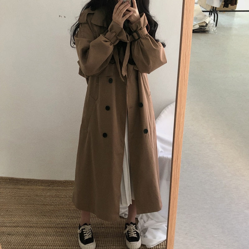 Brown long double-breasted overcoat with button front and relaxed fit