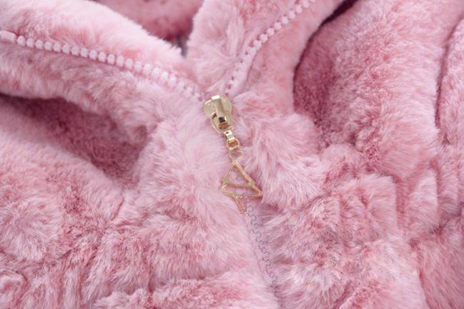 Pink plush hooded jacket close-up of front zipper and gold-tone pull