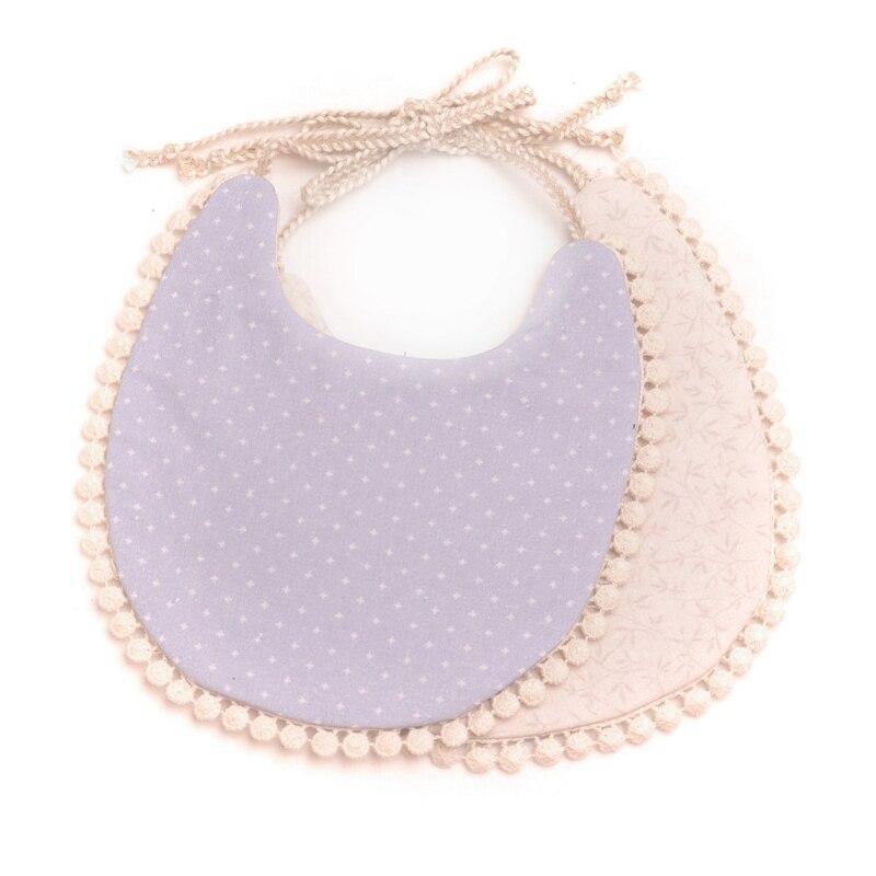 Purple dotted and beige double bib set with pom-pom trim and braided ties.