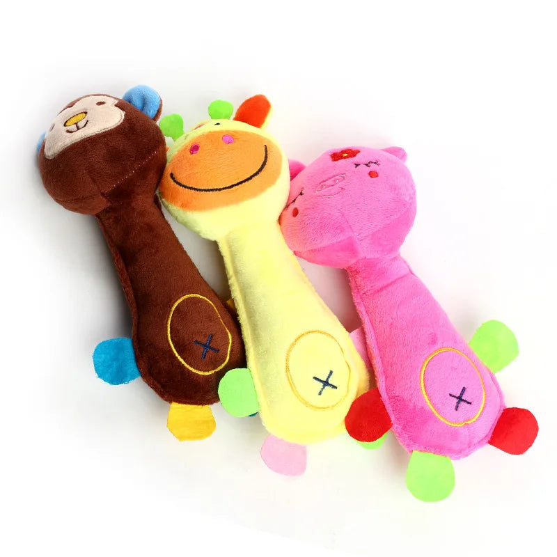 Three plush squeaky dog chew toys in brown, yellow, and pink animal shapes
