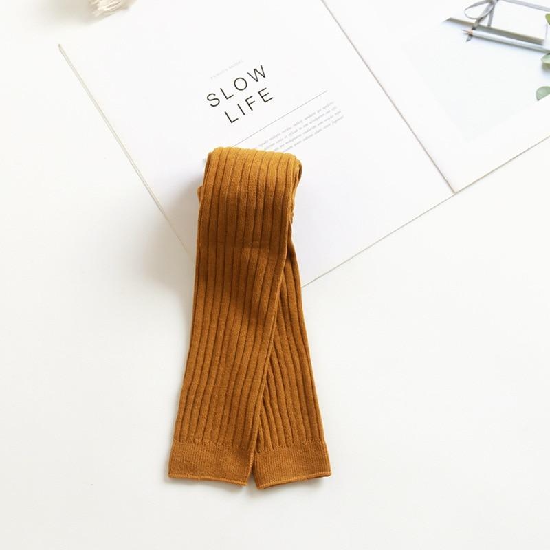 Toddler ribbed knit leggings, mustard-brown folded flat.