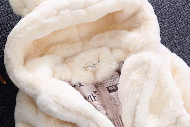 Cream hooded plush jacket interior lining with front zipper opening