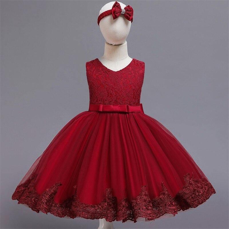Red tulle birthday dress with dark lace trim and waist bow; red head bow