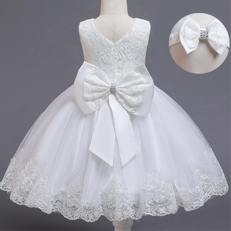 White lace tulle dress with V-neck bodice and oversized satin bow