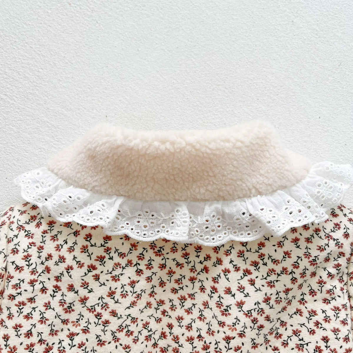 Baby winter jacket with floral print, sherpa-lined high collar and lace ruffle