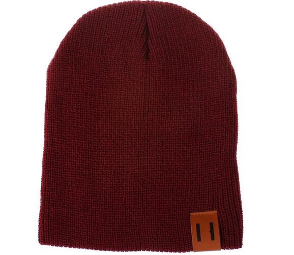 Burgundy knit beanie hat with front logo patch